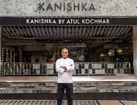 Chef Atul Kochhar standing in front of Kanishka restaurant in London, showcasing modern Indian cuisine.