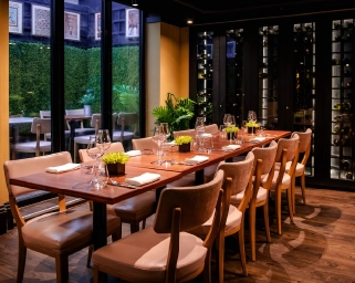 Elegant private dining room at Kanishka restaurant in London, featuring a sophisticated table setup and garden views.