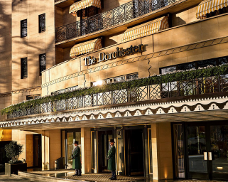 The Dorchester Hotel entrance with doormen, London.